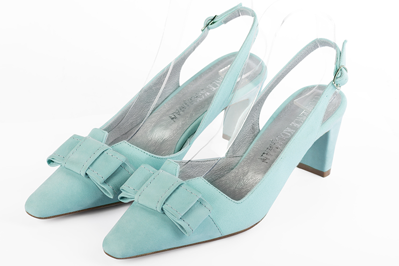 Aquamarine blue women's open back shoes, with a knot. Tapered toe. Medium comma heels. Front view - Florence KOOIJMAN